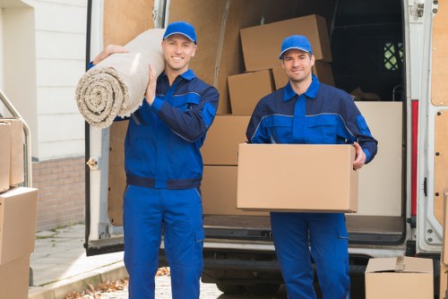 Furniture and packed boxes inside a removal van