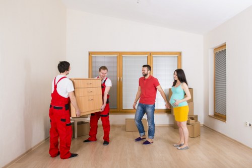 Local movers transporting furniture during a Ruislip relocation