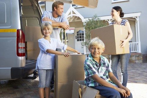 Moving day planning with boxes and labeled furniture in Ruislip