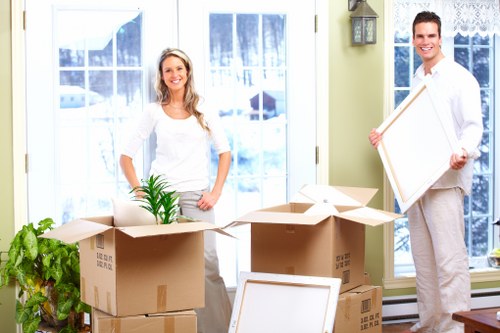 Professional movers securing furniture for transport in Ruislip