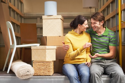 Professional movers handling furniture during a same day relocation